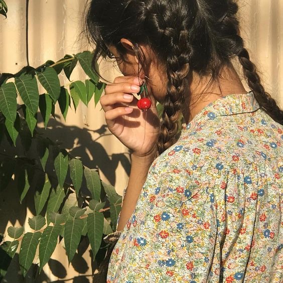 girl with cherry earrings